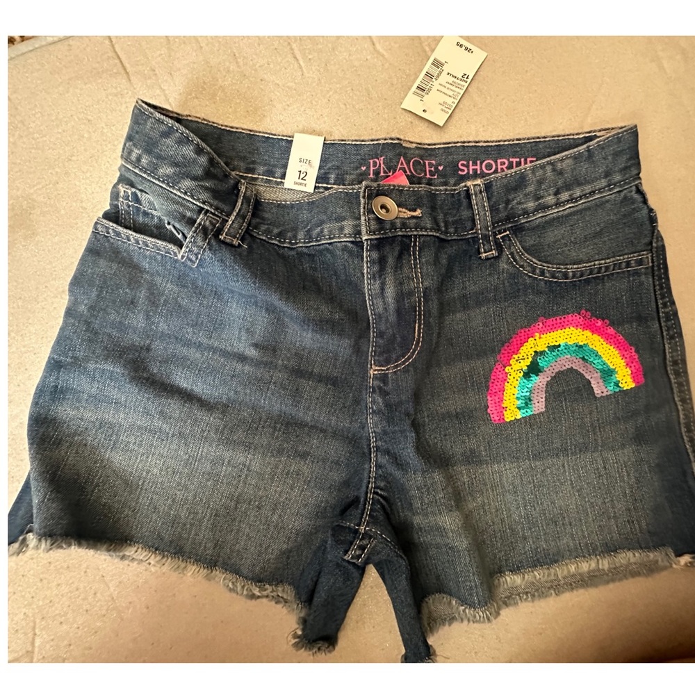 Children’s Place Denim shorts sz 12 New With Tags. Rainbow decals/design.